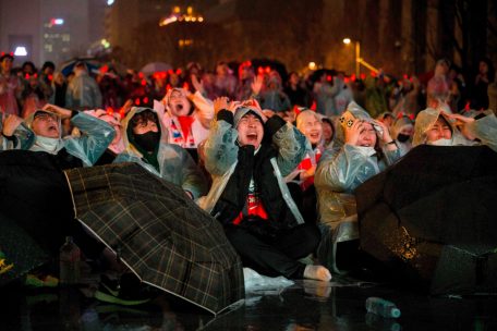 South Korean fans react as they attend a public screening in Seoul on November 28, 2022, of the Qatar 2022 World Cup Group H football match between South Korea and Ghana being played at the Education City Stadium in Al-Rayyan, west of Doha. (Photo by Anthony WALLACE / AFP)